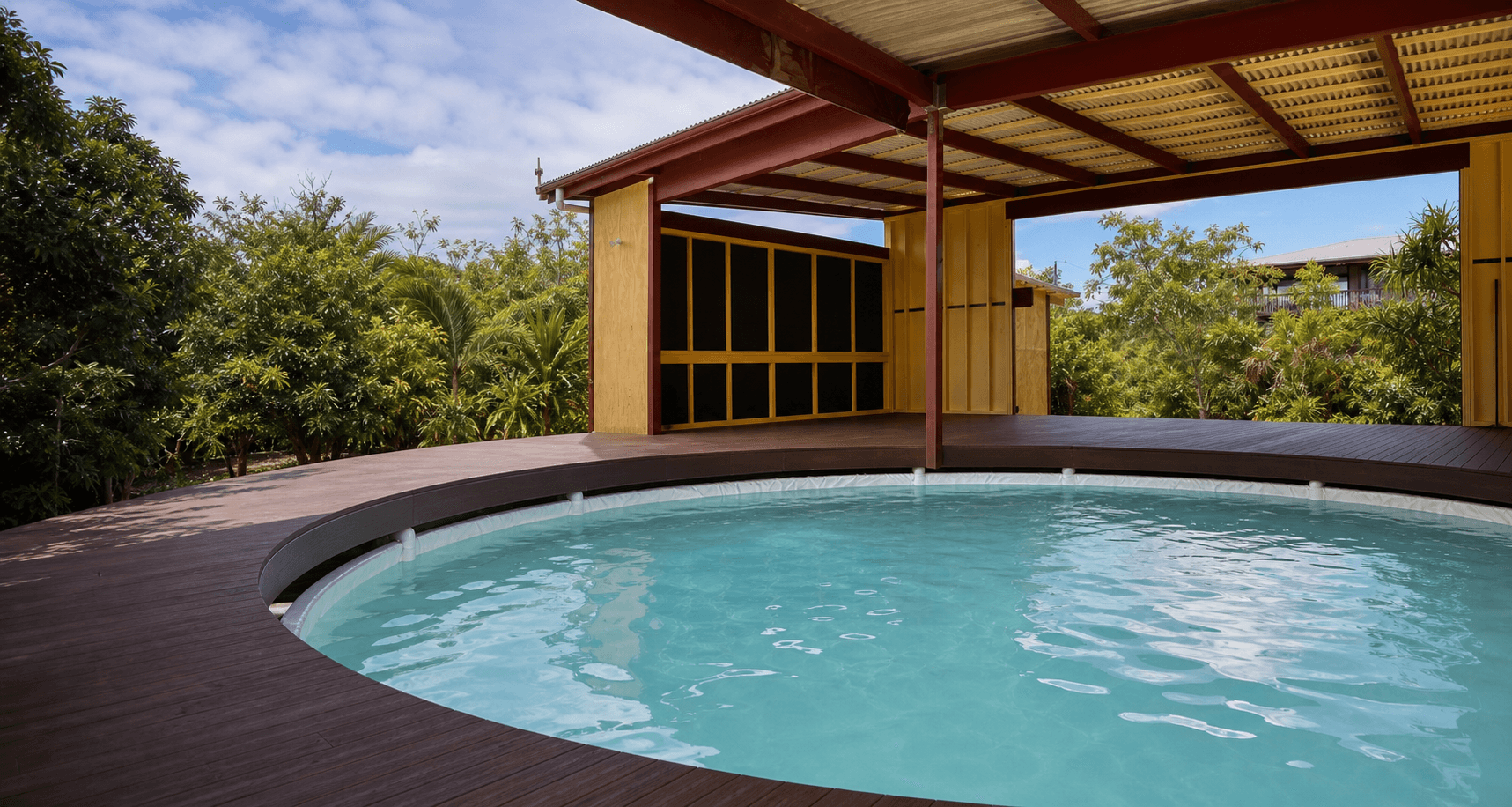 Private tropical pool surrounded by greenery